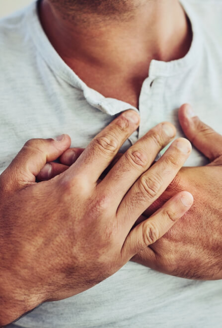 Man holding his chest