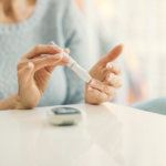 Mature Woman Doing Blood Sugar Test at home