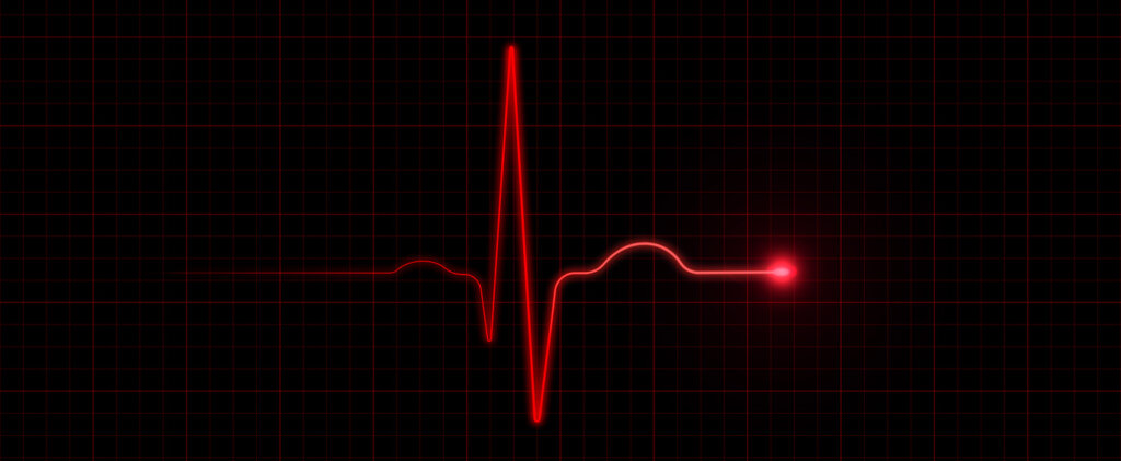 Red EKG on black background. Horizontal composition with copy space.